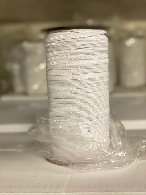 white knitted elastic by the spool